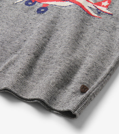 Close-up of the gray marled sweater hem with part of the plane motif and a small Hatley badge