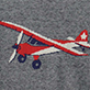 Red and blue single-engine airplane with white accents on a gray textured background