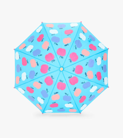 Top view of blue umbrella canopy with pink, white, and purple apple print