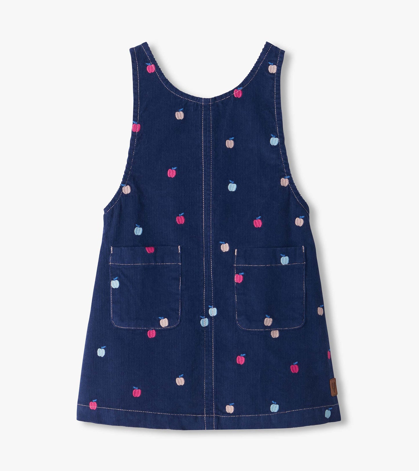 Front view of navy apple embroidered pinafore dress with two front patch pockets