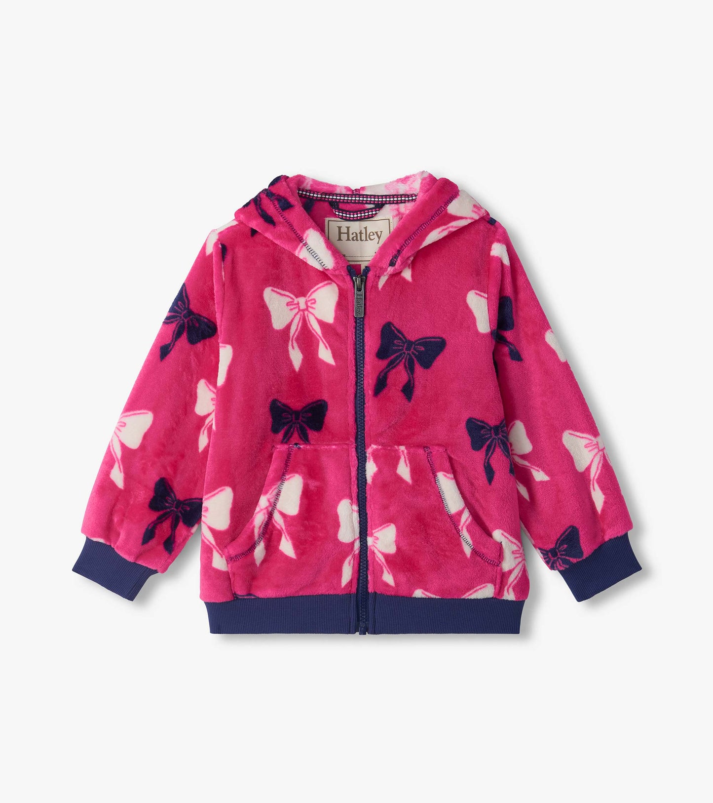 Pink zip-up hoodie with hood, front pockets, navy trim, and white and navy bow print