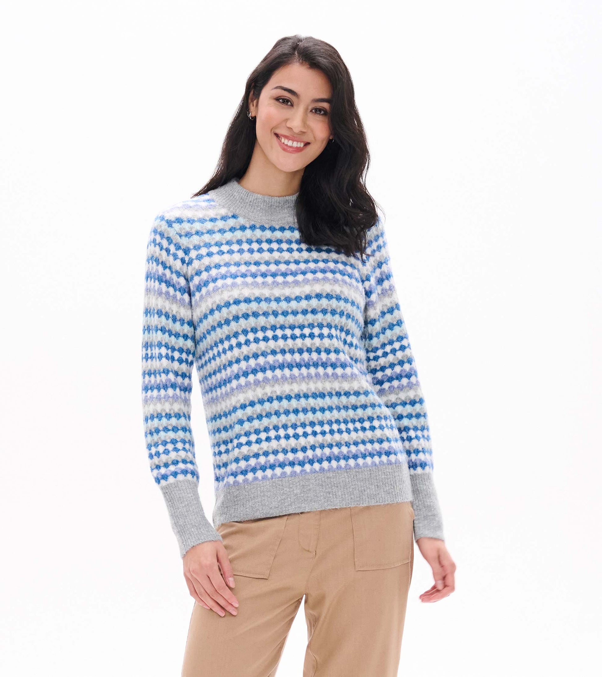 Front view of blue ombre sweater with dotted stripe pattern, gray mock neck, cuffs and hem