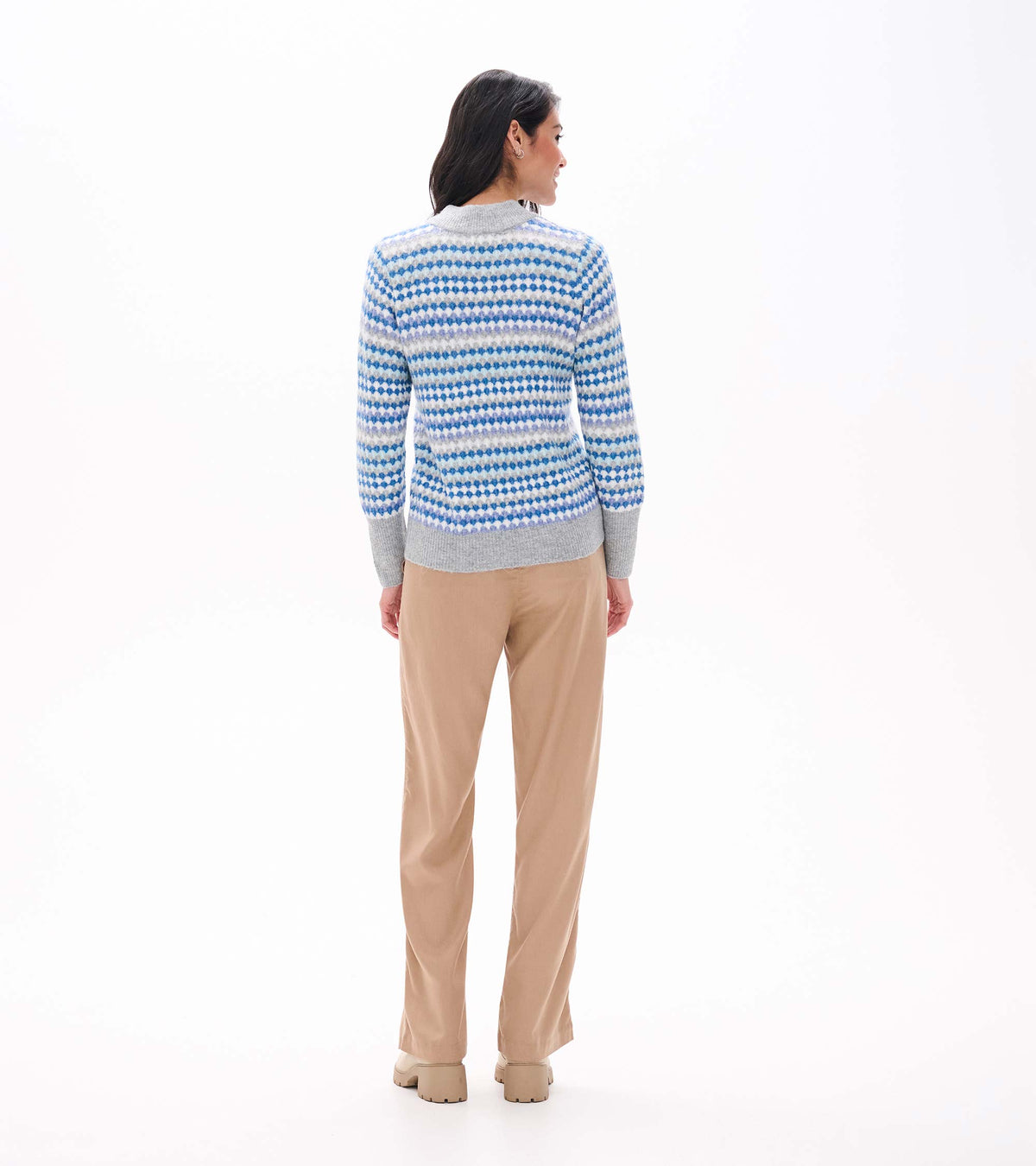 Back view of blue ombre sweater with dotted stripe pattern and gray mock neck, cuffs and hem