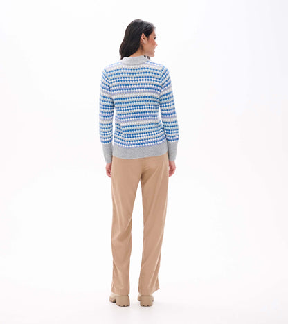 Back view of blue ombre sweater with dotted stripe pattern and gray mock neck, cuffs and hem