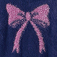 Pink glitter bow on a dark blue background