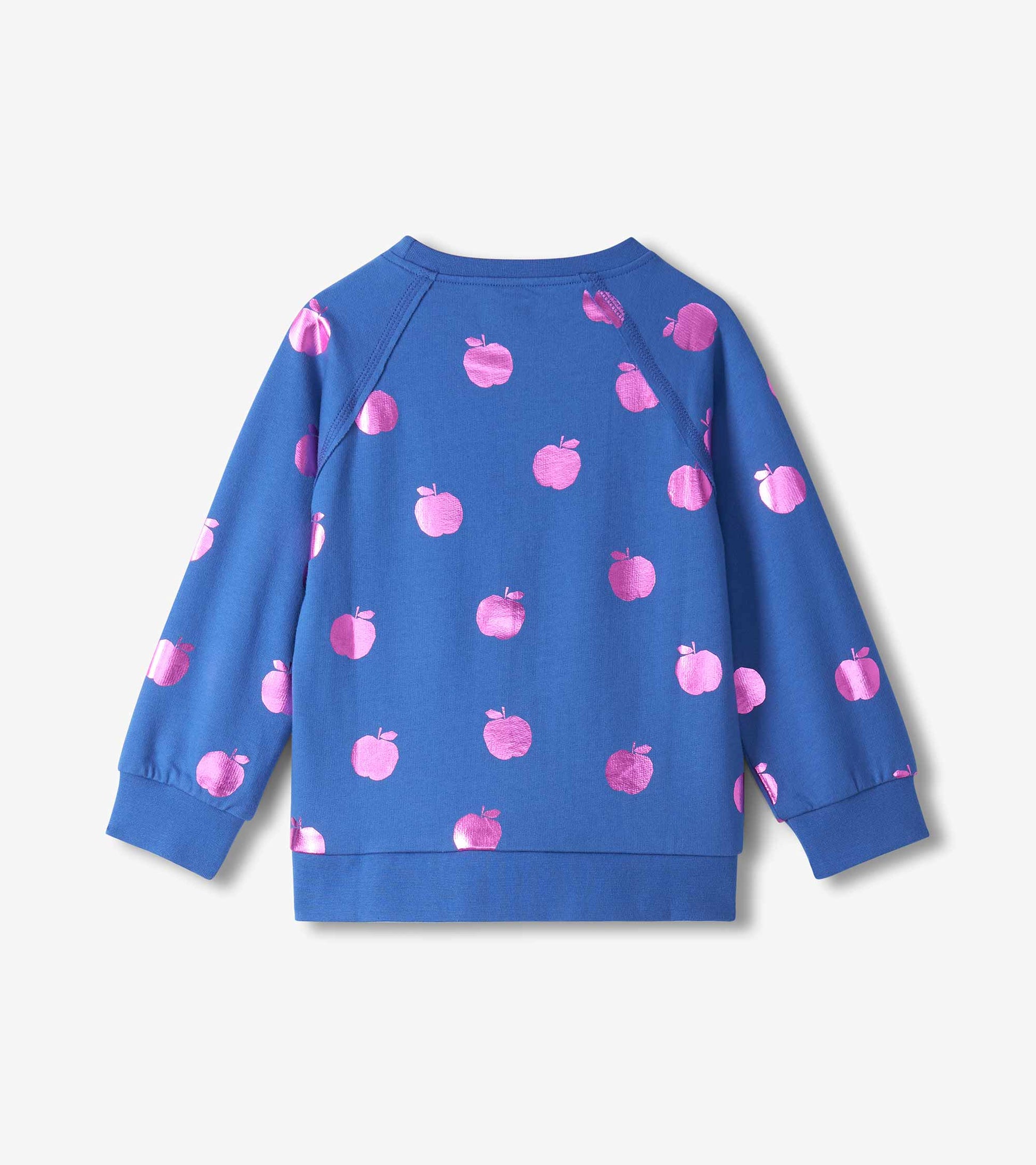 Back view of blue girls pullover with allover pink foil apple print, raglan sleeves, and ribbed hem