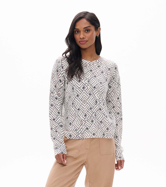 Front view of Noa sweater in cream with black geometric broken ikat pattern and small tan accents