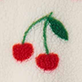 Two red cherries with green stems and leaves