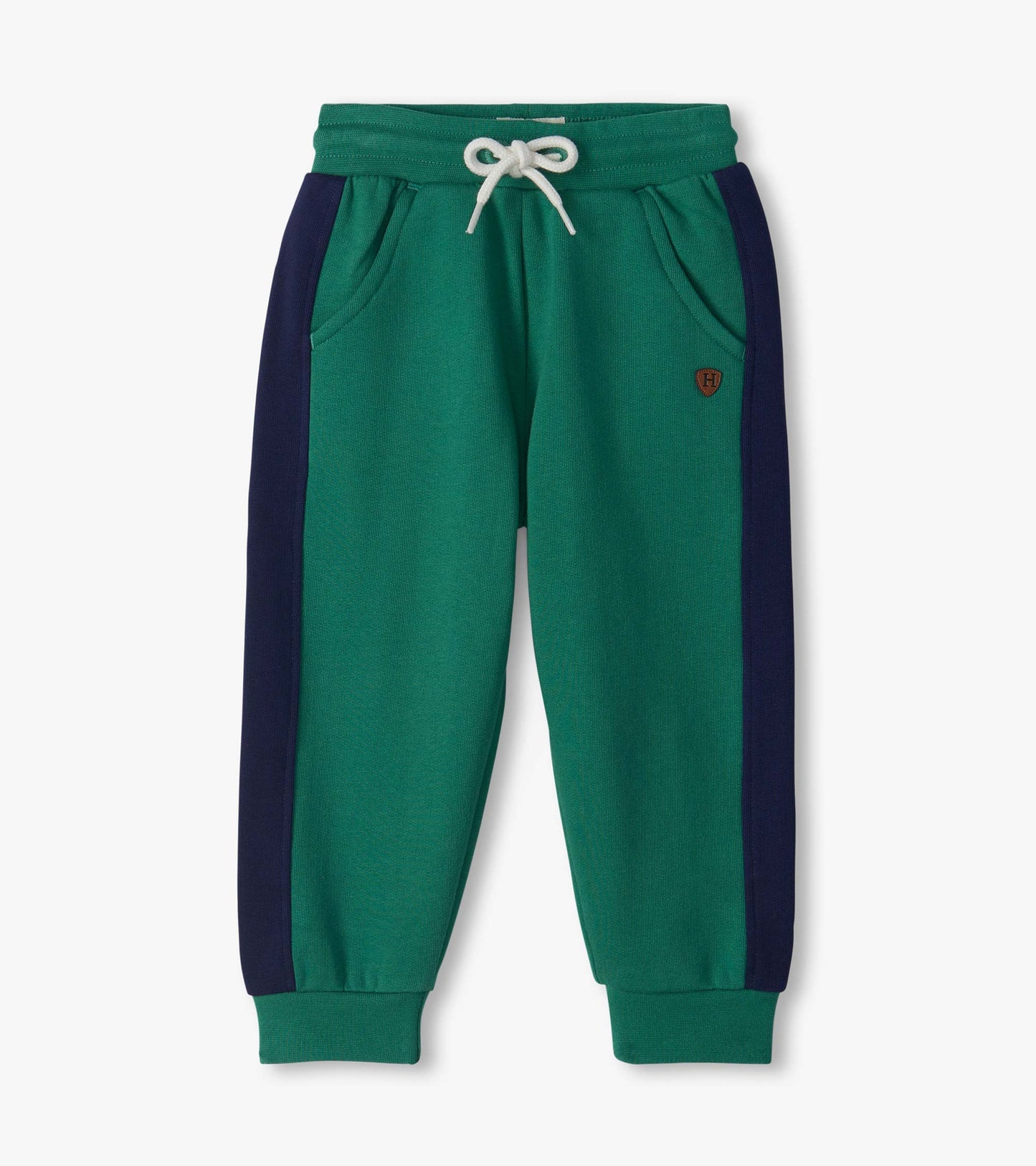 Bottle green track pants with navy side panels, white drawstring waist, side pockets, and cuffed ankles