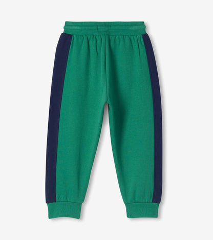 Back view of bottle green toddler track pants with navy side panels and ribbed cuffs