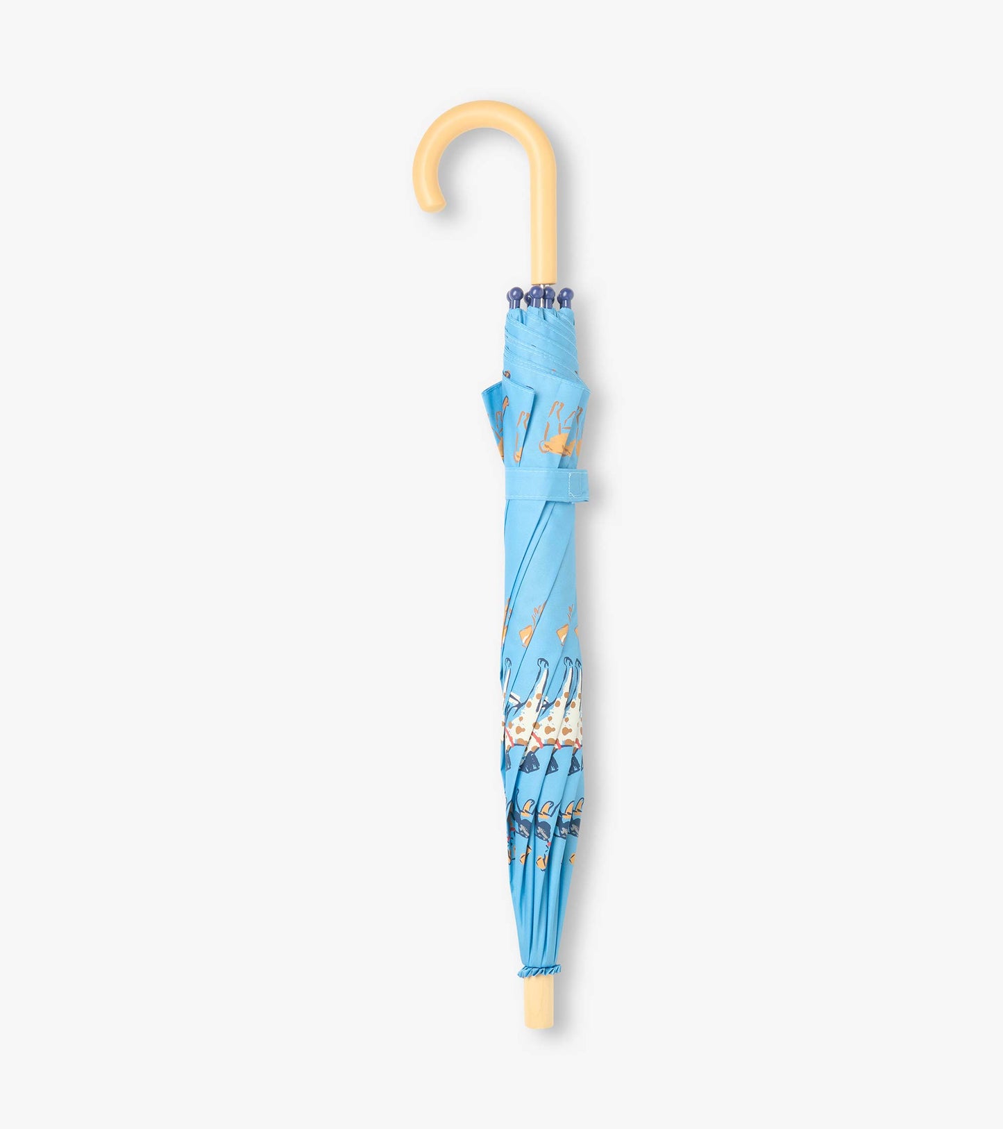 Closed blue umbrella with dog print, wrist strap, and curved beige handle