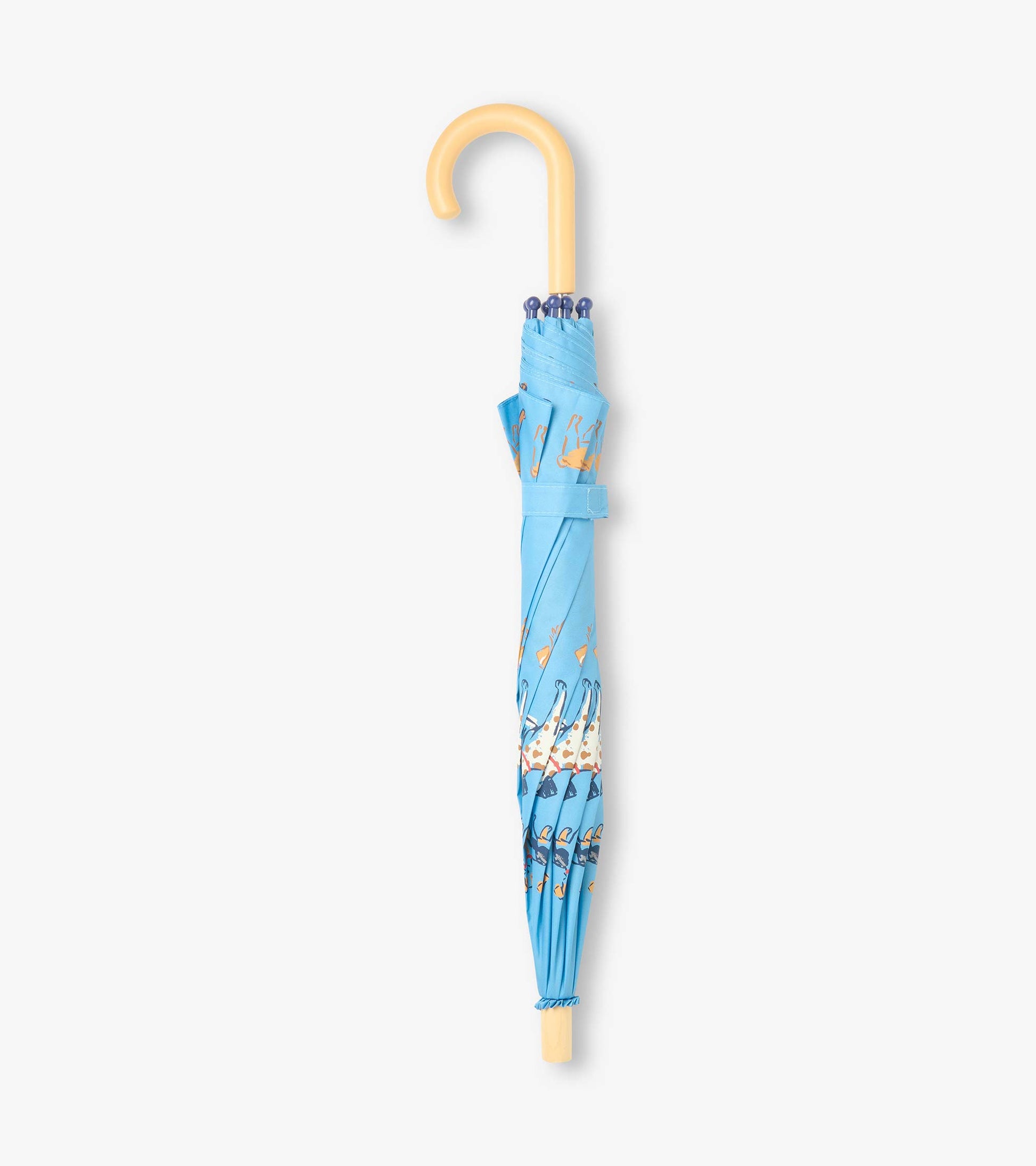 Closed blue umbrella with dog print, wrist strap, and curved beige handle