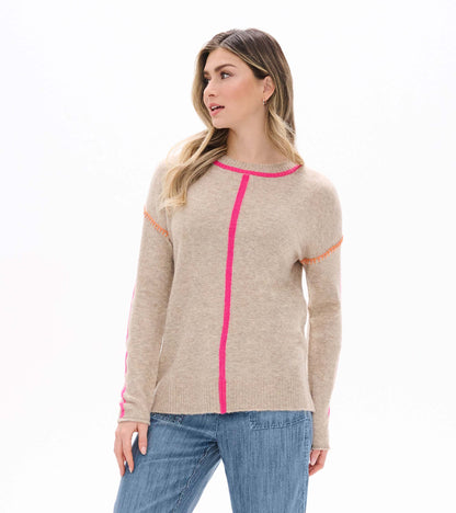 Front view of oatmeal sweater with neon pink trim, center seam detail, and sleeve stripes