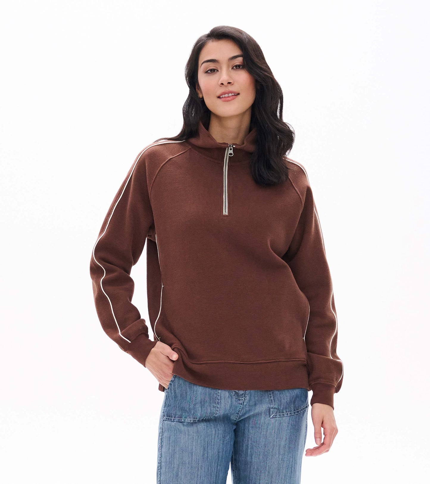 Brown 1/4 zip top with stand collar and white piping down the sleeves, shown from the front