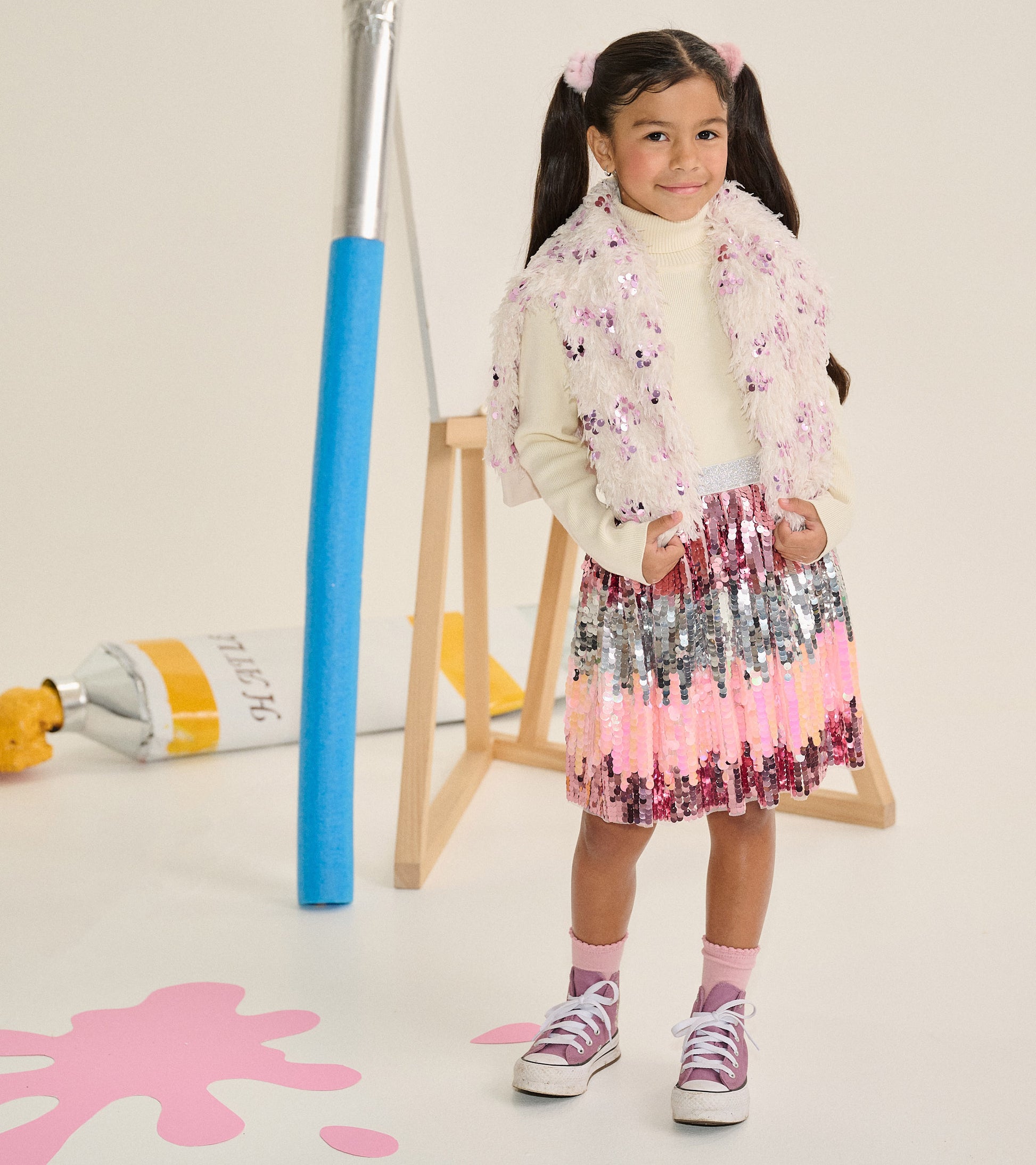 Girl wearing a pink and silver gradient sequin skirt with a silver glitter waistband