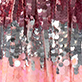 Abstract pink and gray glittery vertical pattern with hanging circular sequins
