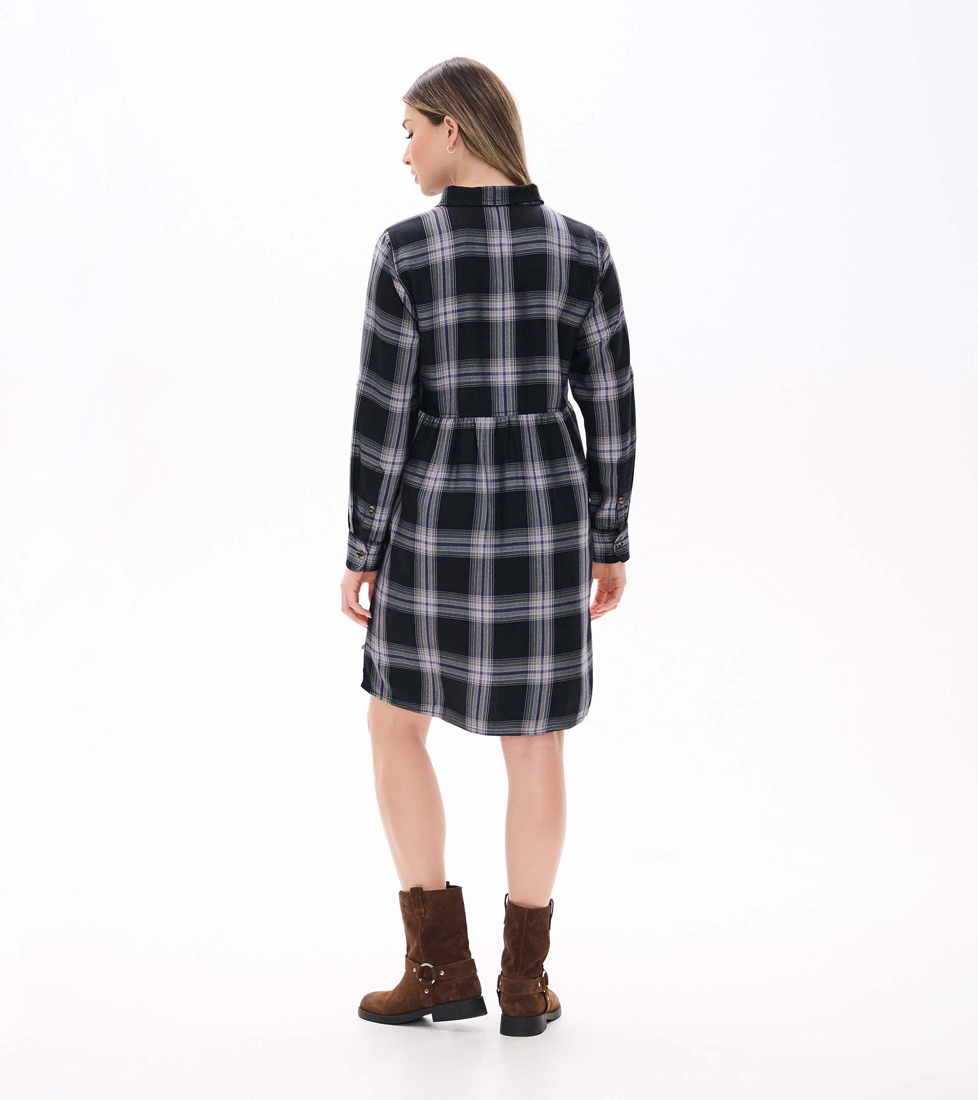 Back view of black and tan plaid shirt dress with long sleeves and a gathered waist seam