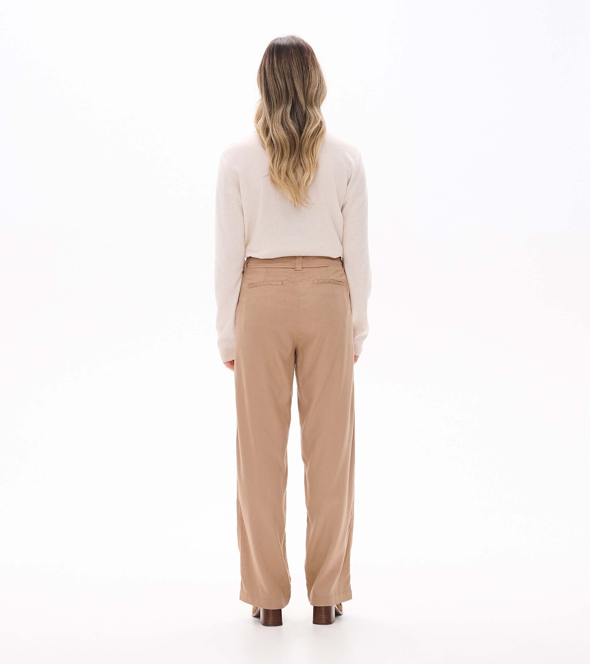 Back view of burro wide leg pants with straight wide legs, belt loops, and back welt pockets