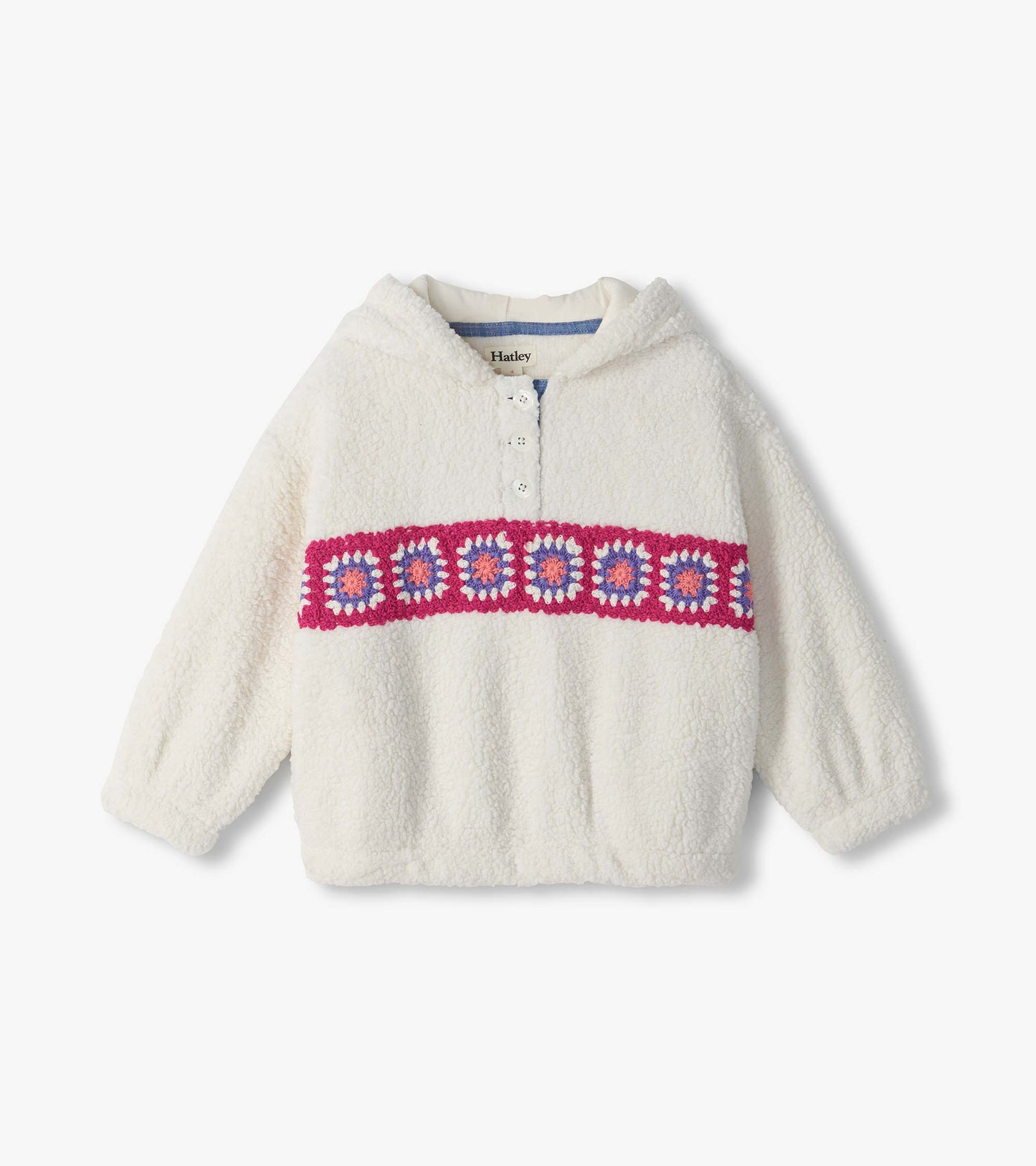 Front view of ivory pullover with half-button collar and pink, purple, and coral crochet band across chest