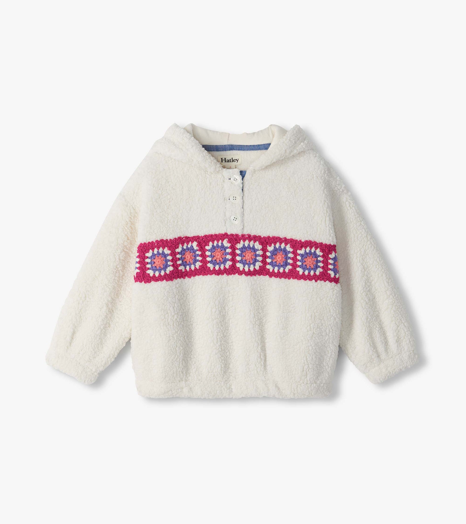 Front view of ivory pullover with half-button collar and pink, purple, and coral crochet band across chest