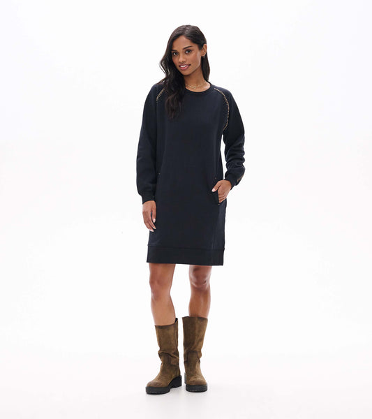 Front view of black sweatshirt dress with long sleeves, side pockets, and contrast stitching