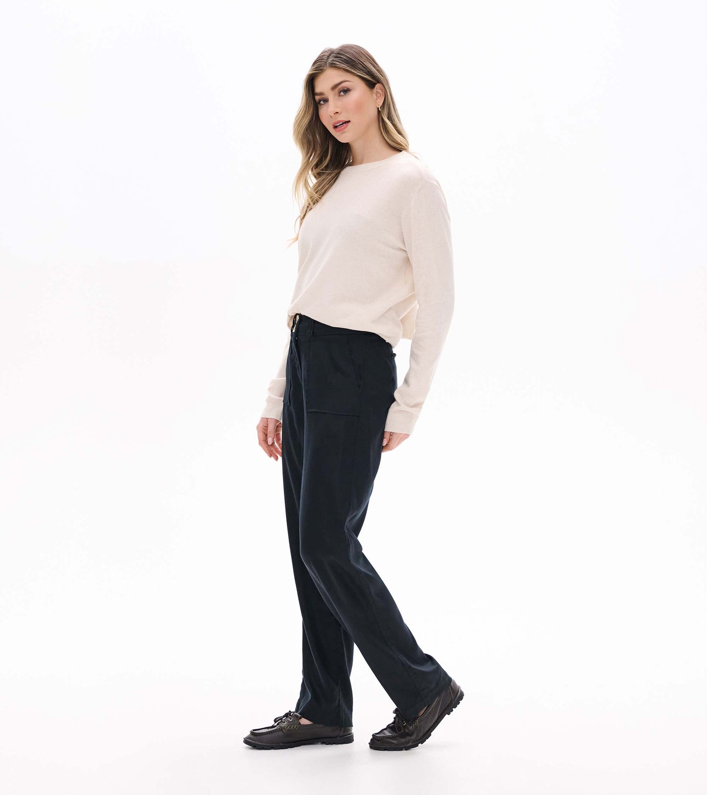 Black wide leg pants shown in a side view on a model