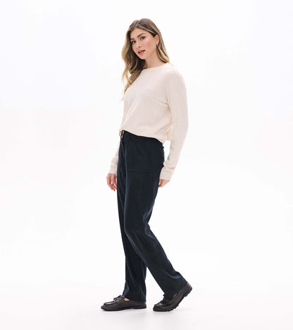 Black wide leg pants shown in a side view on a model
