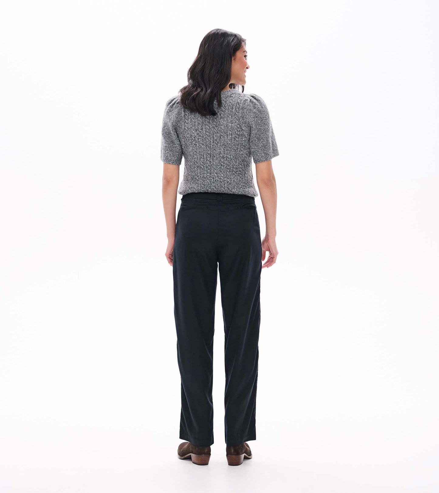 Black wide leg pants shown from the back on a model