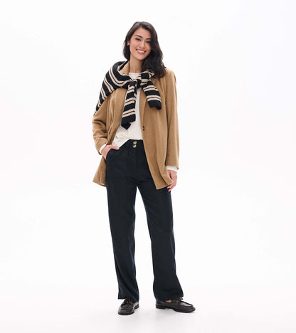 Black wide leg pants shown full length with a relaxed fit and front button detail