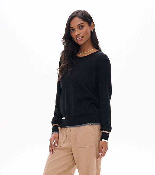 Black crew neck sweater on model with long sleeves and contrast trim at the hem and cuffs