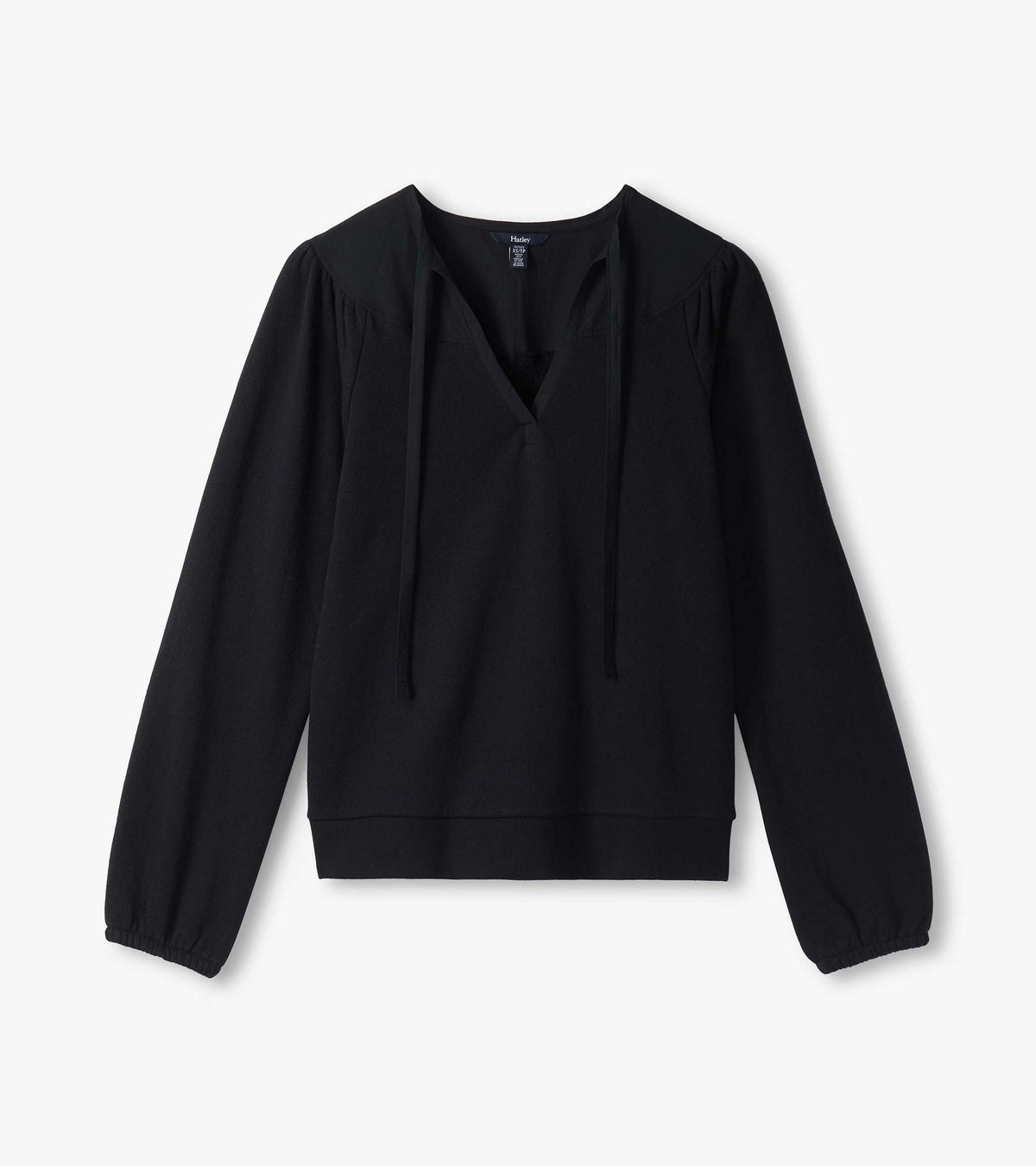 Black Mix Match Top laid flat with V-neck tie detail, gathered shoulders, long sleeves and banded hem