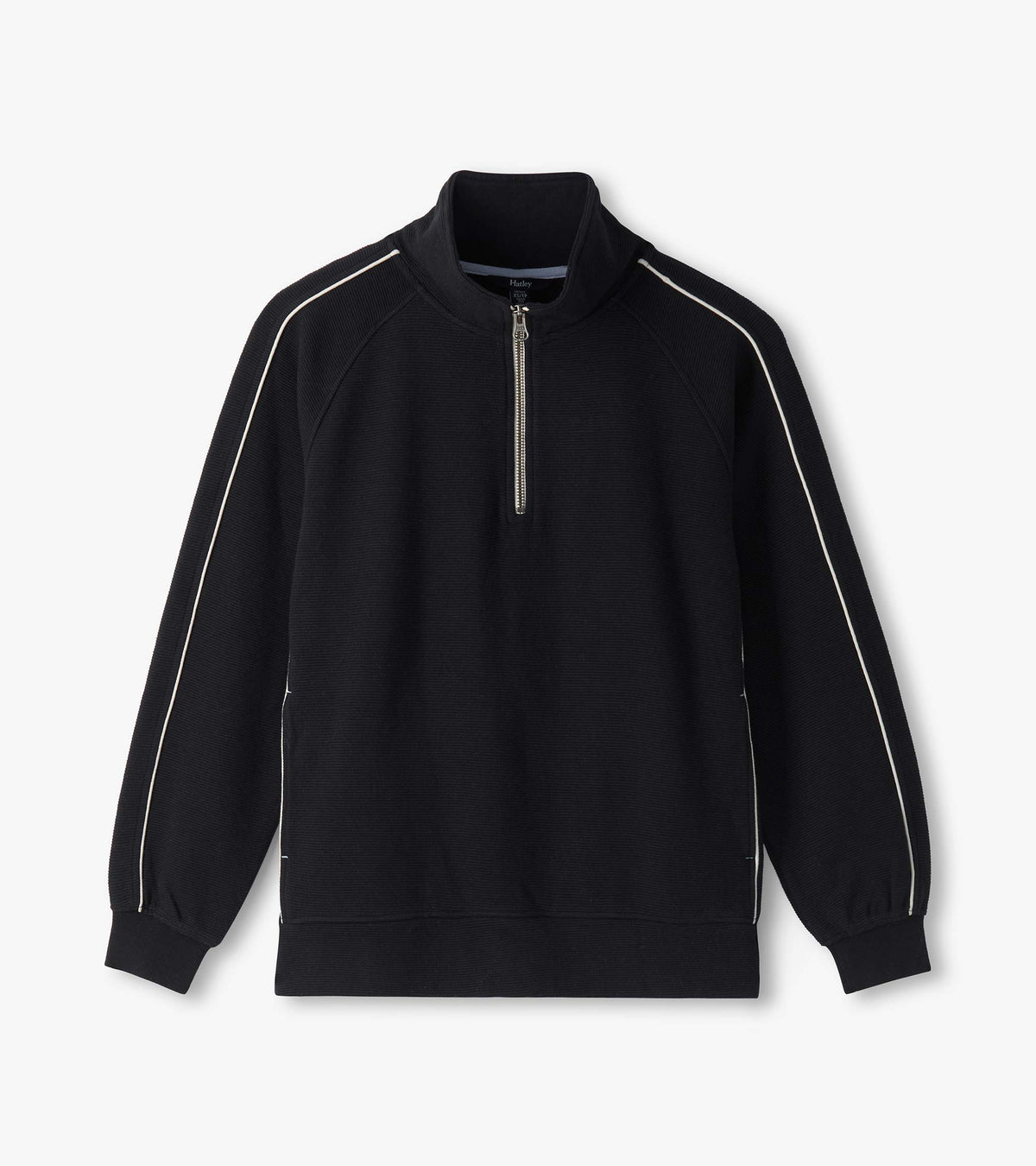Black 1/4 zip knit top laid flat with stand collar, raglan sleeves, and white piping details