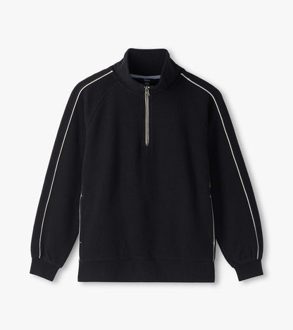 Black 1/4 zip knit top laid flat with stand collar, raglan sleeves, and white piping details