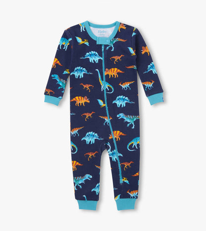 Front view of navy dinosaur print coverall with teal trim, cuffs, and ankle-to-neck zipper