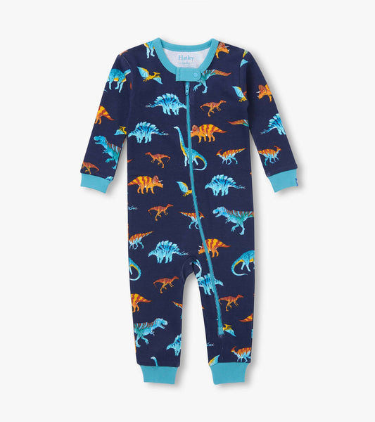 Front view of navy dinosaur print coverall with teal trim, cuffs, and ankle-to-neck zipper
