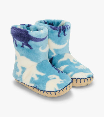 Pair of blue Dino Silhouette fleece slippers with white and navy dinosaur print
