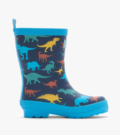 Side view of navy rain boot with colorful dinosaur print and bright blue sole and trim