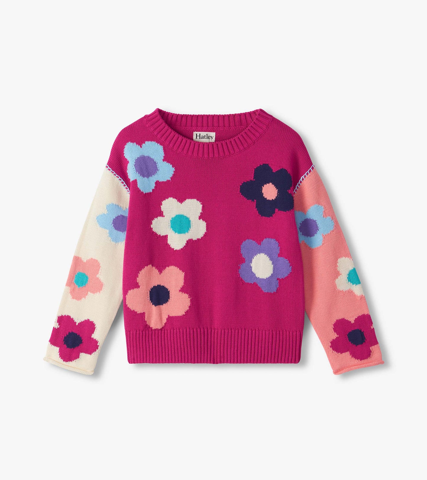 Front view of girls slouchy sweater in bright pink with multicolor floral pattern and ribbed crew neck