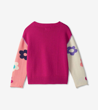 Back view of girls slouchy sweater in bright pink with floral colorblock sleeves and ribbed hem