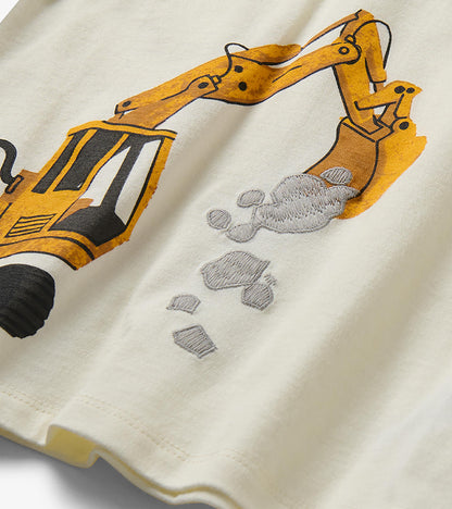 Close-up of yellow digger graphic with gray embroidered rocks on cream T-shirt