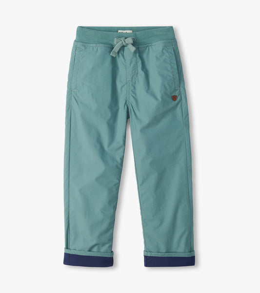 Kids' green pull-on pants with drawstring waist, front pockets, and navy cuffed hems