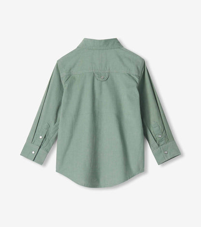 Back view of boys green long sleeve shirt with back yoke, curved hem, and snap cuff tabs