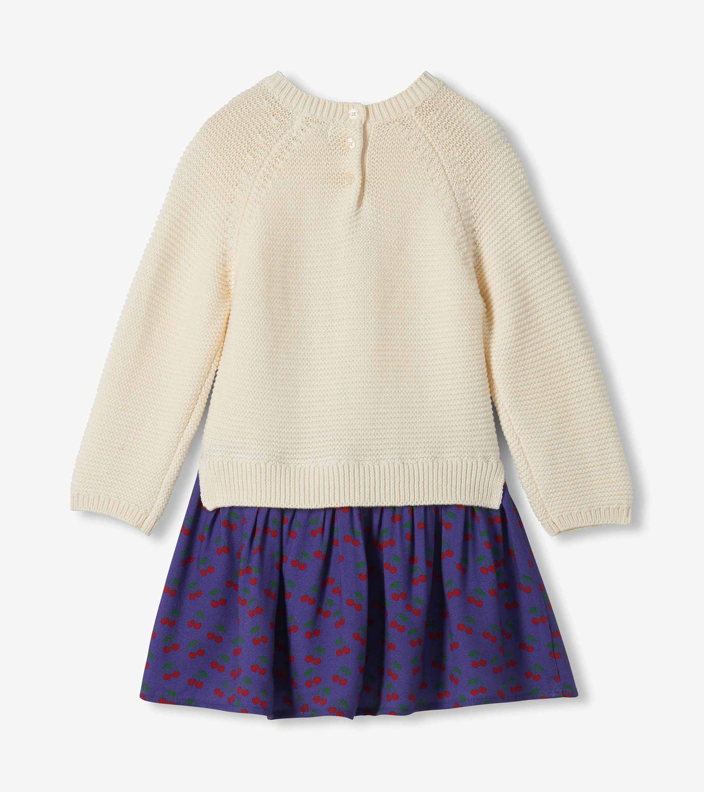 Back view of girls sweater dress with cream knit top, back buttons, and purple cherry-print skirt