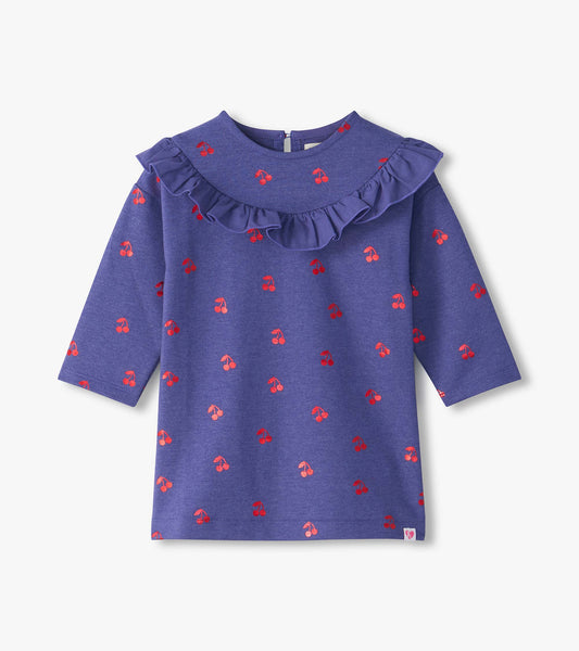 Front view of purple long sleeve dress with red cherry print and ruffle yoke