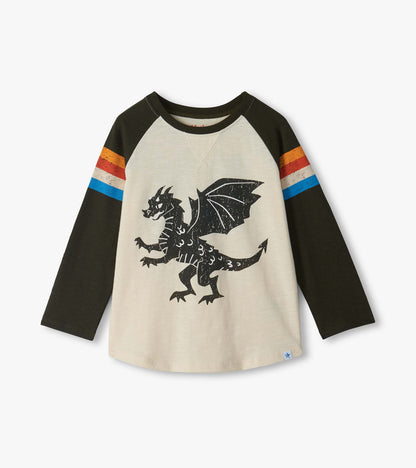 Front of kids raglan tee with cream body, black sleeves, striped arms, and black dragon graphic