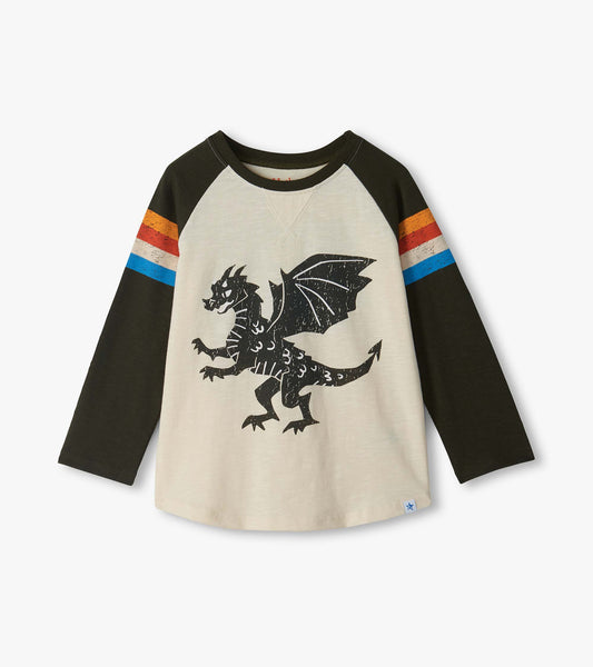 Front of kids raglan tee with cream body, black sleeves, striped arms, and black dragon graphic