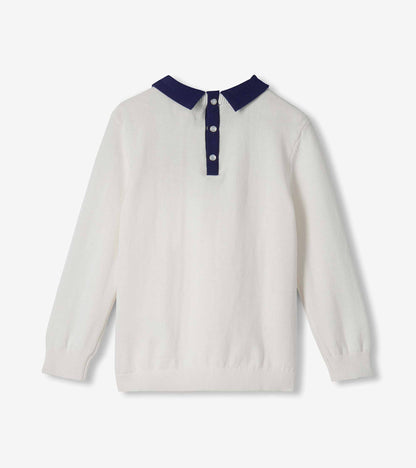 Back view of cream girls sweater with navy collar and three-button snap placket