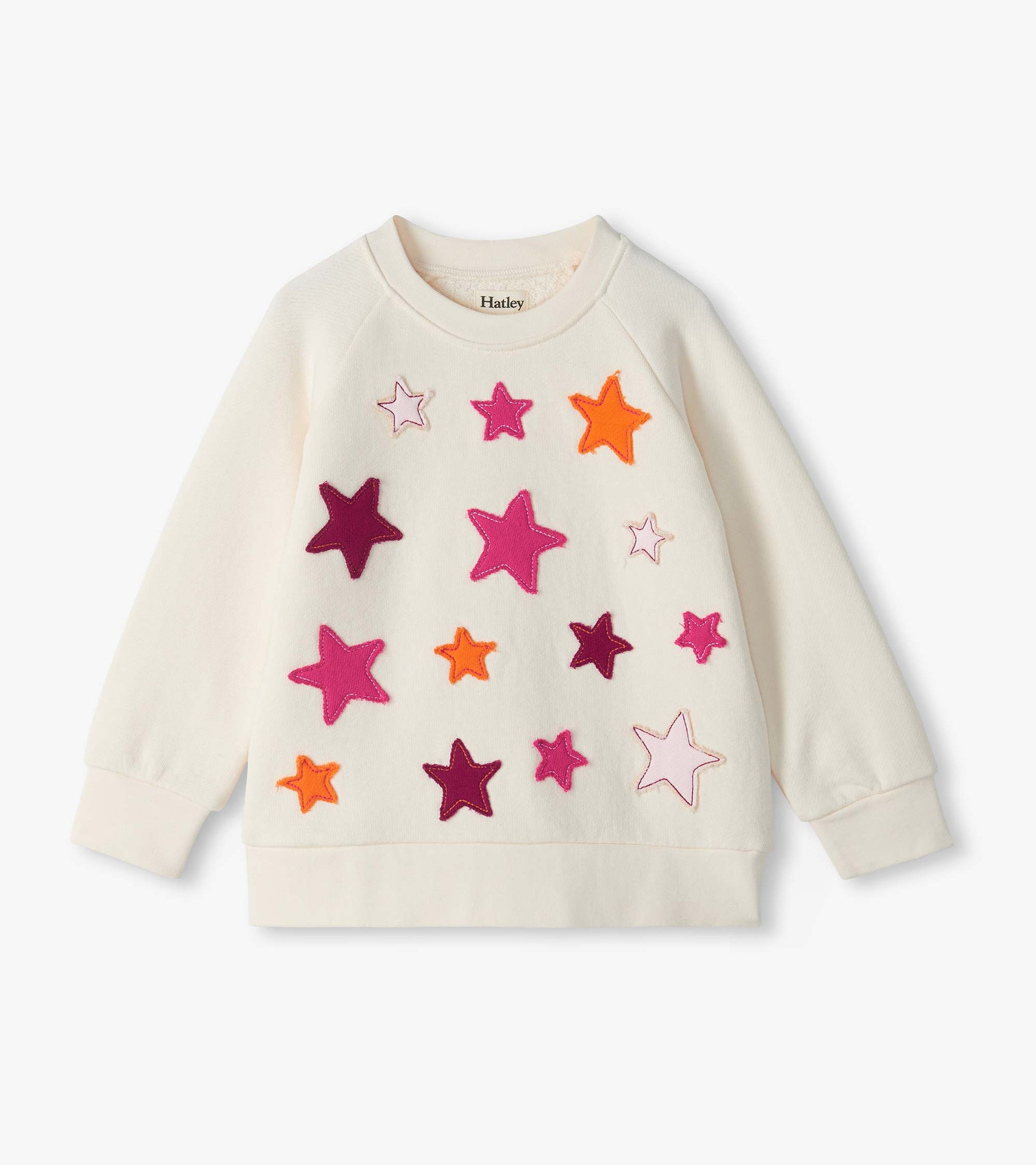 Cream slouchy pullover sweatshirt with colorful star appliqués on the front and long sleeves