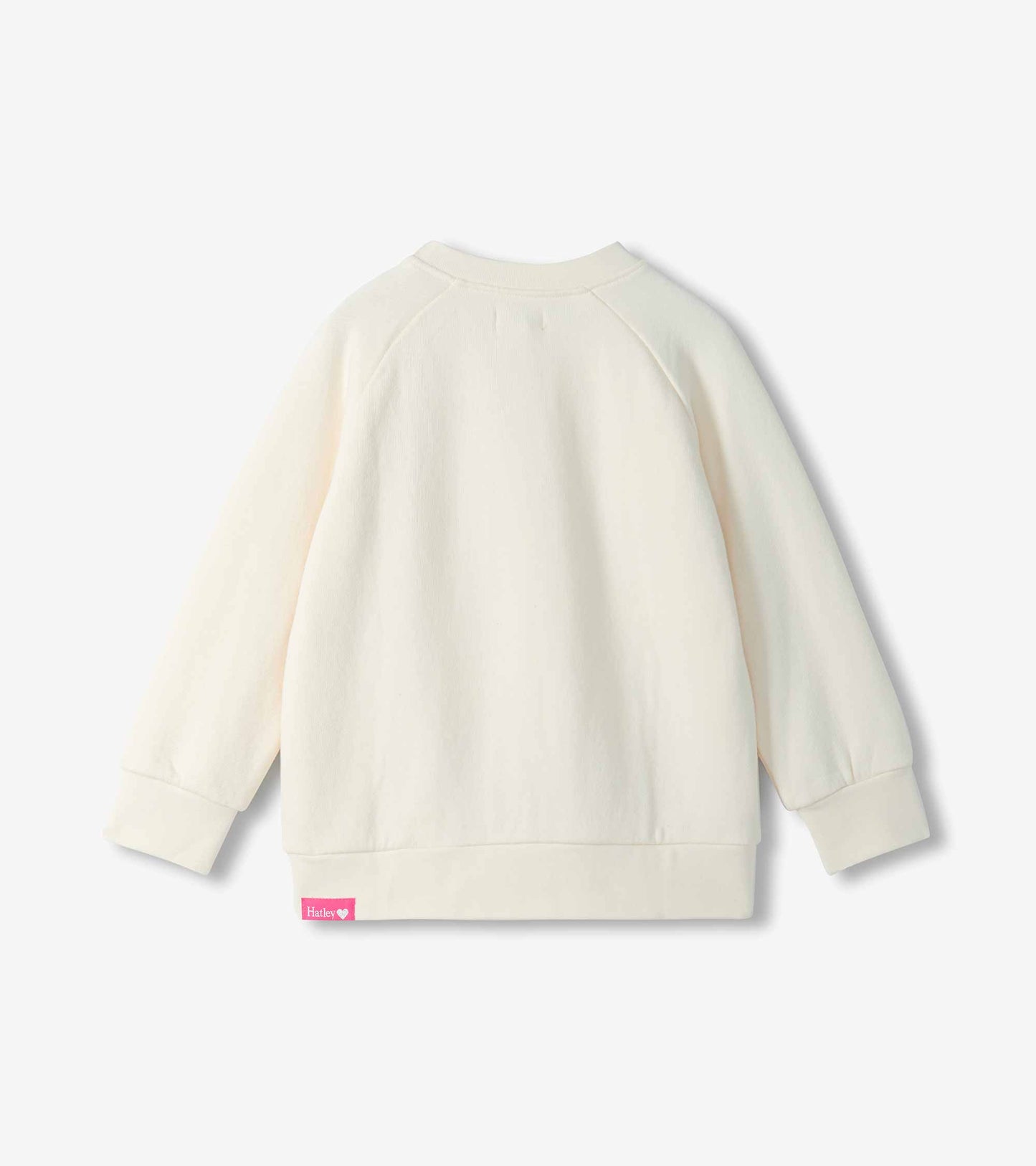 Back view of cream girls slouchy pullover with raglan sleeves and ribbed cuffs and hem