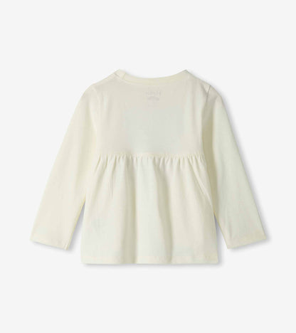Back view of ivory long-sleeve toddler T-shirt with gathered waist seam